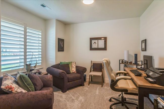 Home office featuring light carpet and plenty of natural light | Image 5