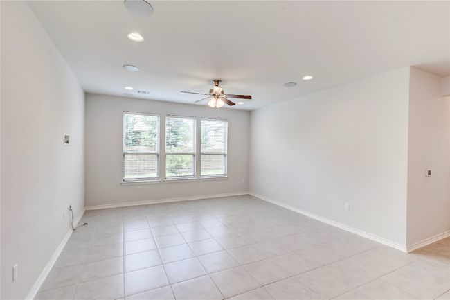 Spare room featuring a ceiling fan, recessed lighting, light tile patterned flooring, and baseboards | Image 7