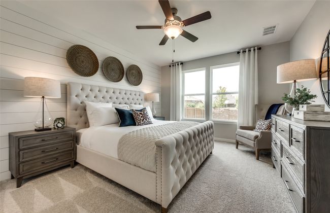 Elegant owner's suite with large windows *Photos of furnished model. Not actual home. Representative of floor plan. Some options and features may vary | Image 16