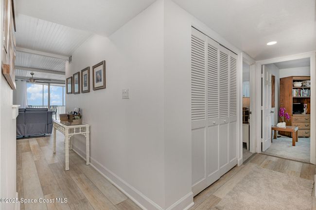 Hallways leading to living area and guest bedrooms | Image 21