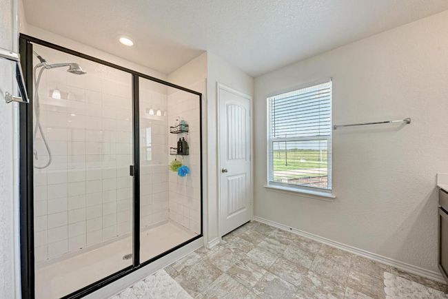 Bathroom featuring a shower stall and vanity | Image 26