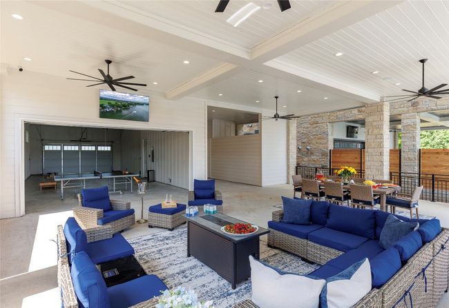 Outdoor living space to watch the game or play some ping pong or corn hole. | Image 9