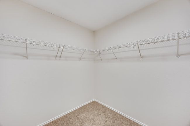 Spacious closet with carpet flooring | Image 31