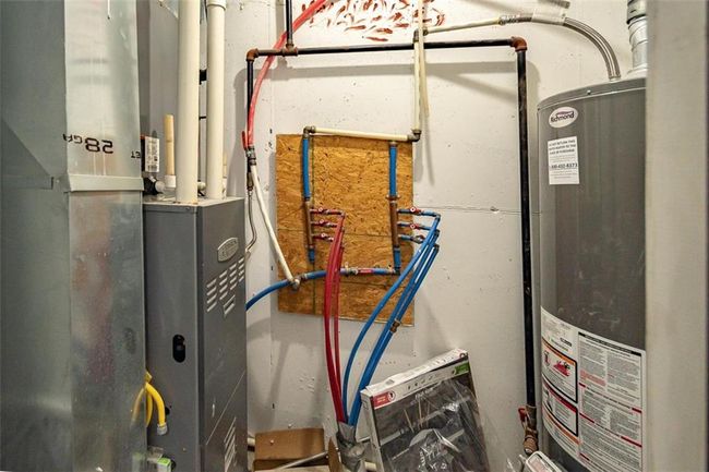 Utility room with gas water heater | Image 36