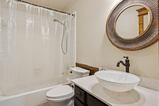 This bathroom has been updated by the seller. Adjacent to the secondary bedroom on the 1st floor. | Image 10
