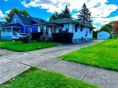 View of front of home with a front yard and an outbuilding | Image 2