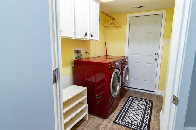 View from breakfast area into utility room and door access to the two-car garage. | Image 39