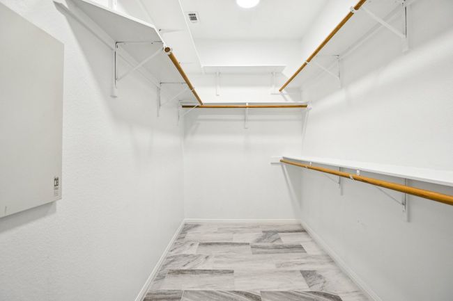 Walk in closet with light marble finish flooring | Image 18