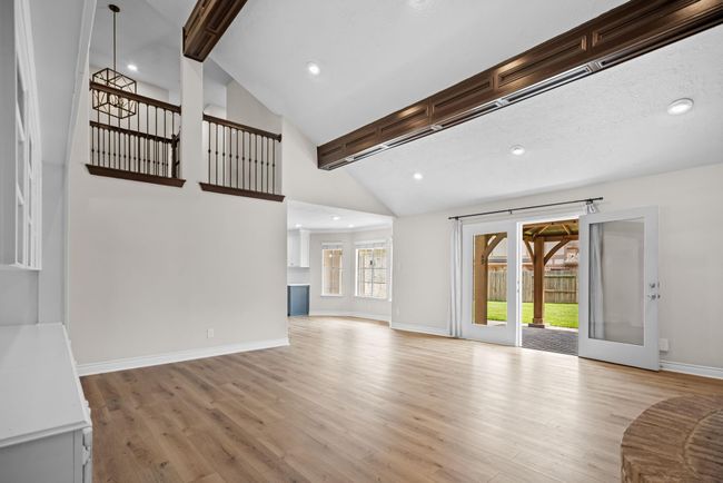 Vaulted ceilings in the den overlooks the back yard | Image 19