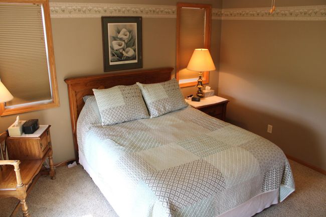 Main floor primary bedroom. | Image 55