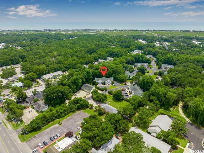 Aerial view of a heavily wooded area | Image 36