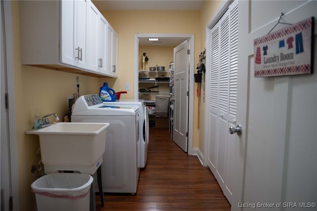 Laundry FLOWS thru to the LARGE STORAGE AREA. | Image 51