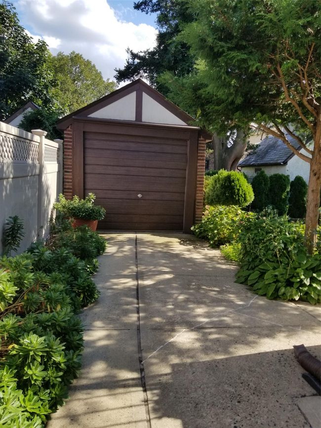 Detached garage with fence and driveway | Image 16