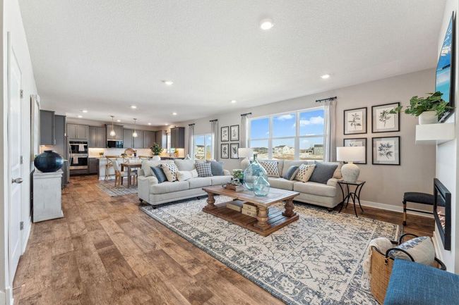9' ceilings and a wall of windows really show off your main floor. Photo of model home, colors and finishes will vary. | Image 15