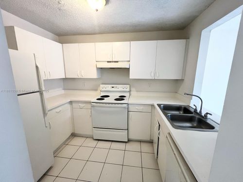 910 Cypress Way E, Palm Springs, FL, 33406-7597 | Card Image