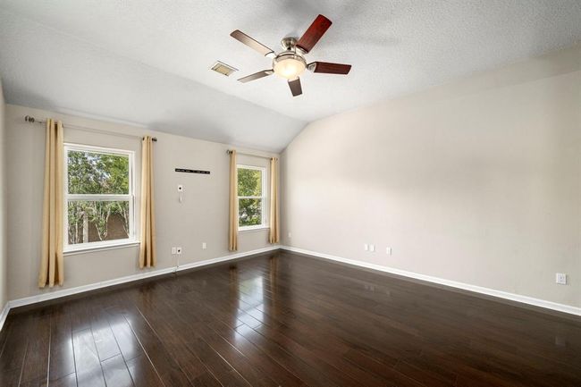 An additional living space game room welcomes you at the top of the stairs | Image 28