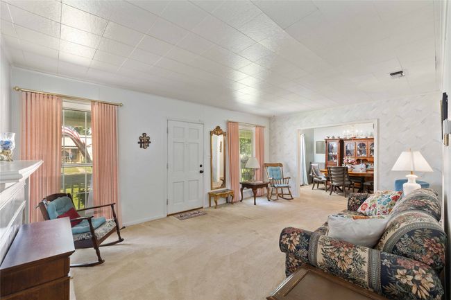 Living room with natural light from windows. | Image 11