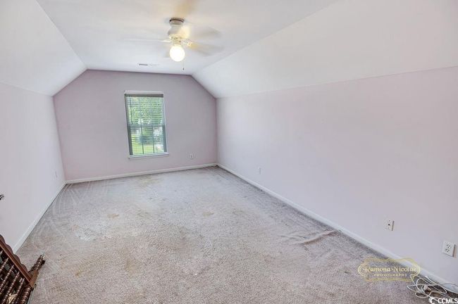 Bonus room featuring carpet floors, lofted ceiling, and a ceiling fan | Image 20