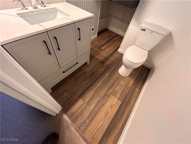Bathroom with vanity and wood finished floors | Image 10