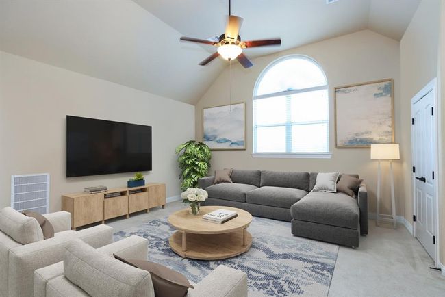 Game room with storrage closet. Carpeted floors. Arched windows. | Image 36