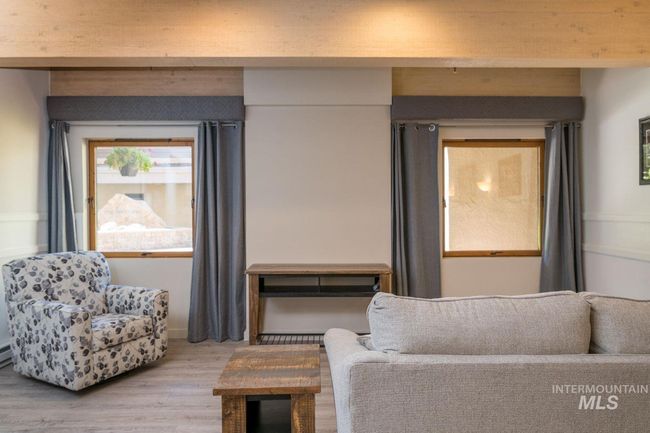 Living room with wood finished floors | Image 4