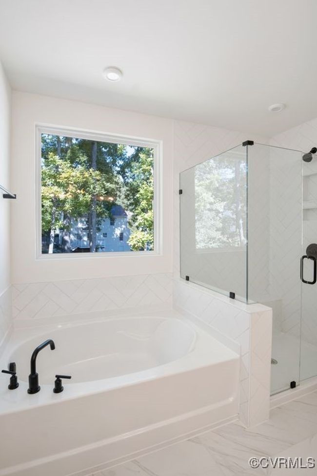 Photo represents the plan, not the actual home. Design selections may vary. On the second floor, you’ll find the primary bedroom featuring a walk-in closet and an ensuite bath with double vanity. | Image 27