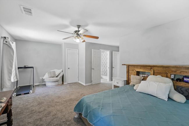Bedroom featuring carpet and a ceiling fan | Image 17