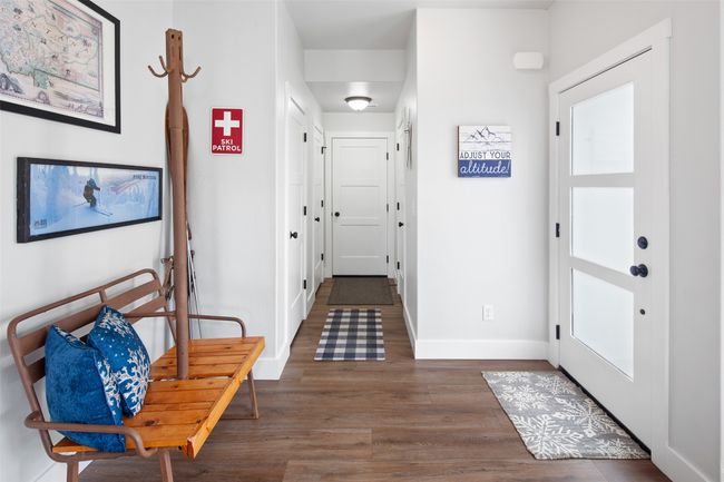 Spacious entry to powder room & garage access. | Image 19
