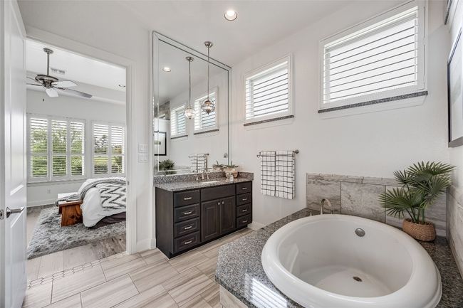 Ensuite bathroom with vanity, a bath, a ceiling fan, and recessed lighting | Image 20