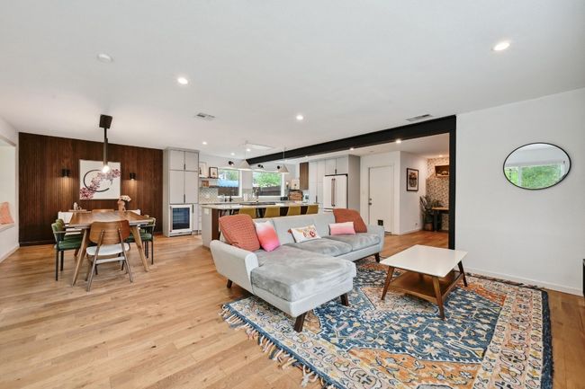 This beautifully remastered floor plan provides for seamless connectivity between the living room and kitchen with just the right amount of separation between your cooking area and relaxation space. | Image 19