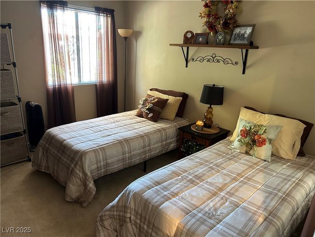 Bedroom featuring carpet | Image 27