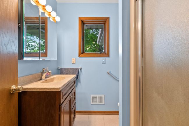 full bath in laundry and garage area entrance | Image 20