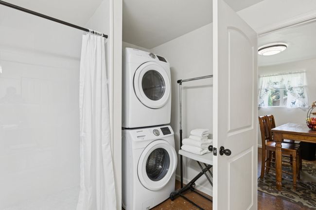 Mother in Law En- Suite Washroom featuring stacked washer / dryer | Image 21