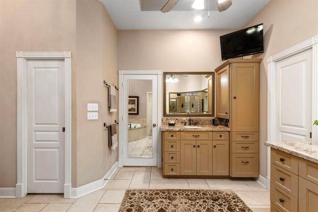 Dual vanities, dual showerheads and even dual water closets (toilets) eliminate the need to negotiate with your partner for coveted storage space and provide additional privacy! Complete with full length mirror for perfect grooming. | Image 19