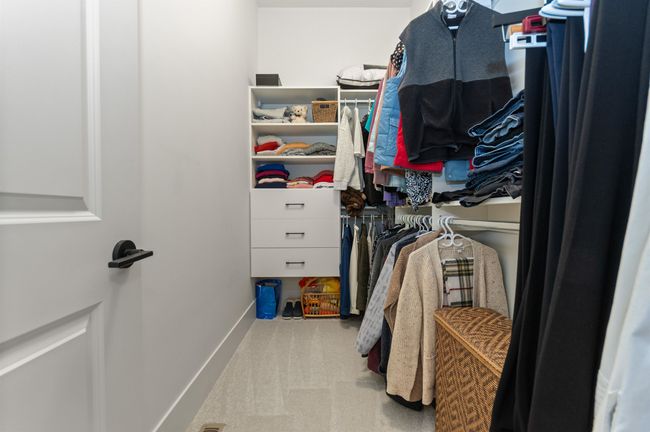 Spacious closet with carpet flooring | Image 19