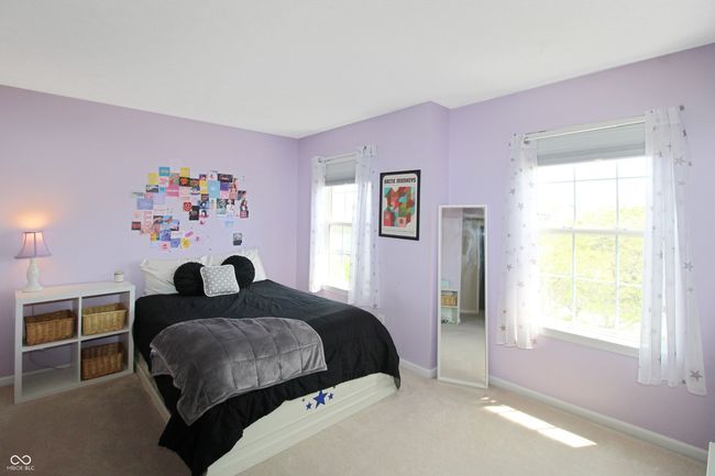 Bright and airy, Bedroom 2 features double windows with views of the front and excellent storage in the walk-in closet. | Image 13