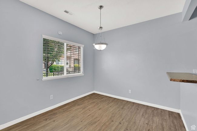 Empty room with wood finished floors and baseboards | Image 10