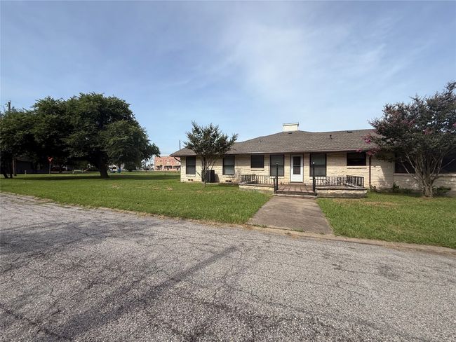 View of backyard and porch with access to a bedroom | Image 15