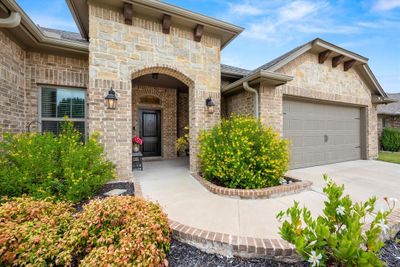 Property entrance with a garage | Image 2