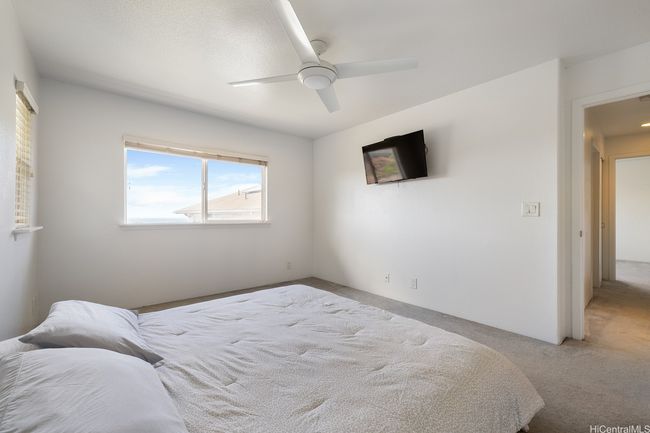 Master bedroom with fresh paint & ocean view. | Image 12