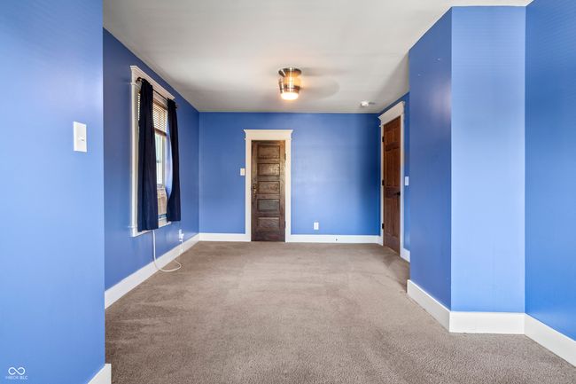 carpeted spare room with baseboards | Image 42