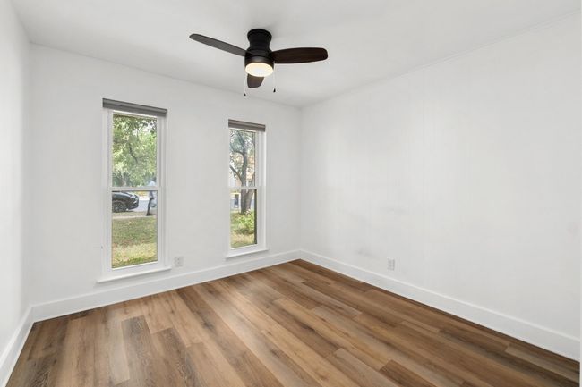 Spare room with wood finished floors and ceiling fan | Image 17