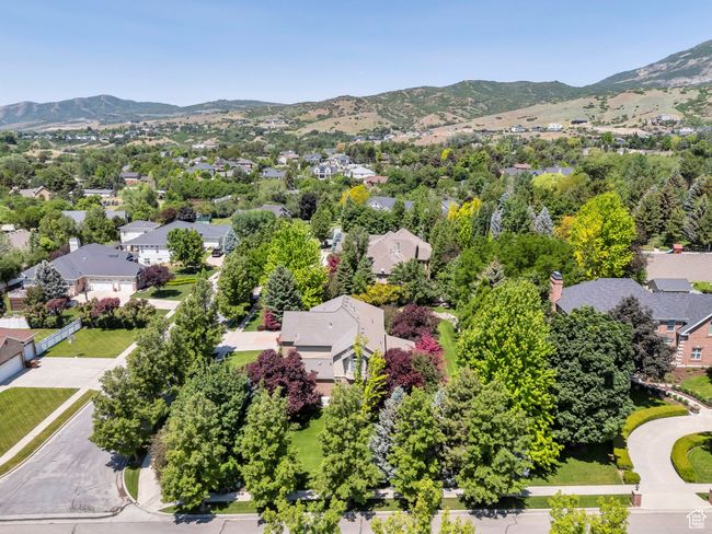Aerial perspective of suburban area featuring a mountain backdrop | Image 34