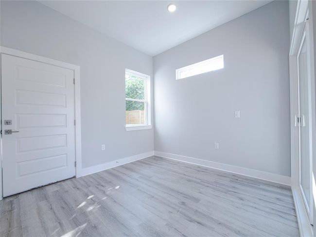 Empty room featuring light wood-style flooring and recessed lighting | Image 11