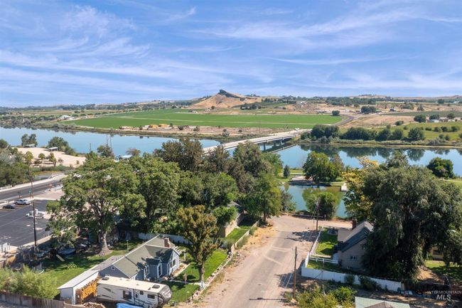 Aerial view of property and surrounding area with a large body of water and a notable bridge | Image 36
