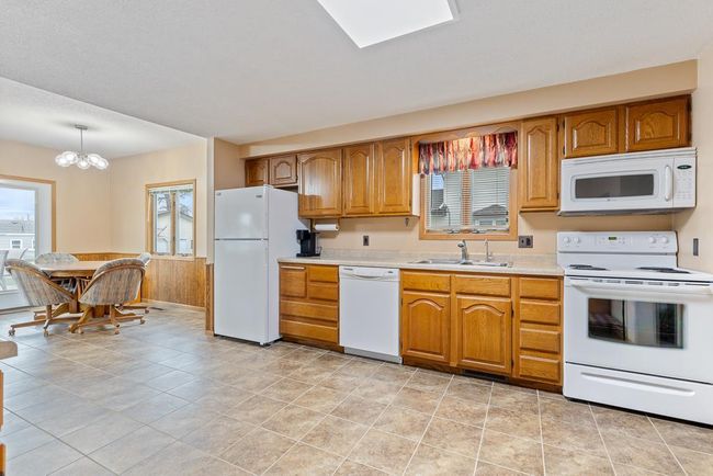 The garage features GREAT storage space in attic | Image 17