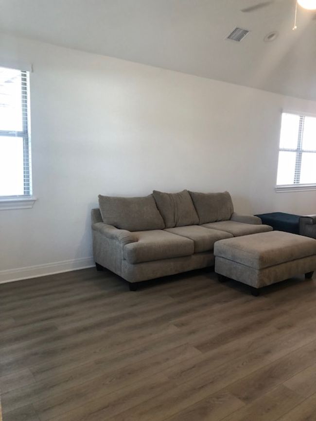 Living room featuring lots of light and a ceiling fan | Image 4