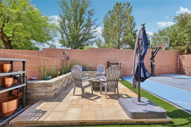View of patio featuring an outdoor fire pit | Image 70
