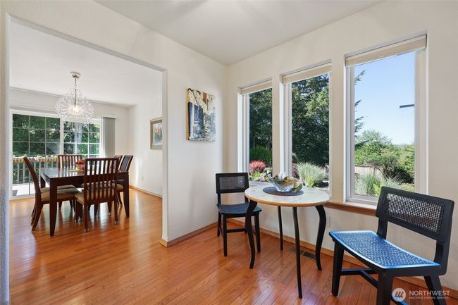 From the dining room is a breakfast area. To the right is the laundry room and garage entrance. | Image 14