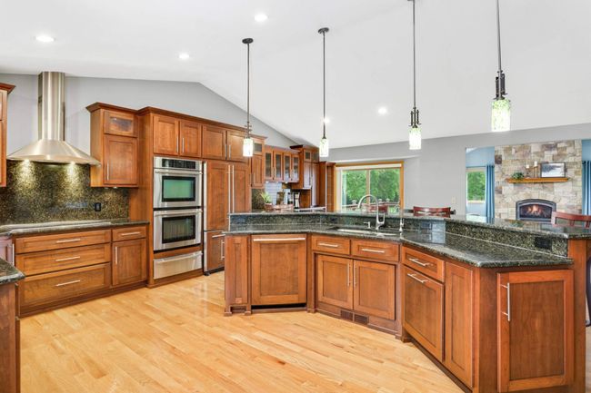 The kitchen is the heart of the home, boasting abundant cabinet space and premium stainless steel appliances. | Image 6